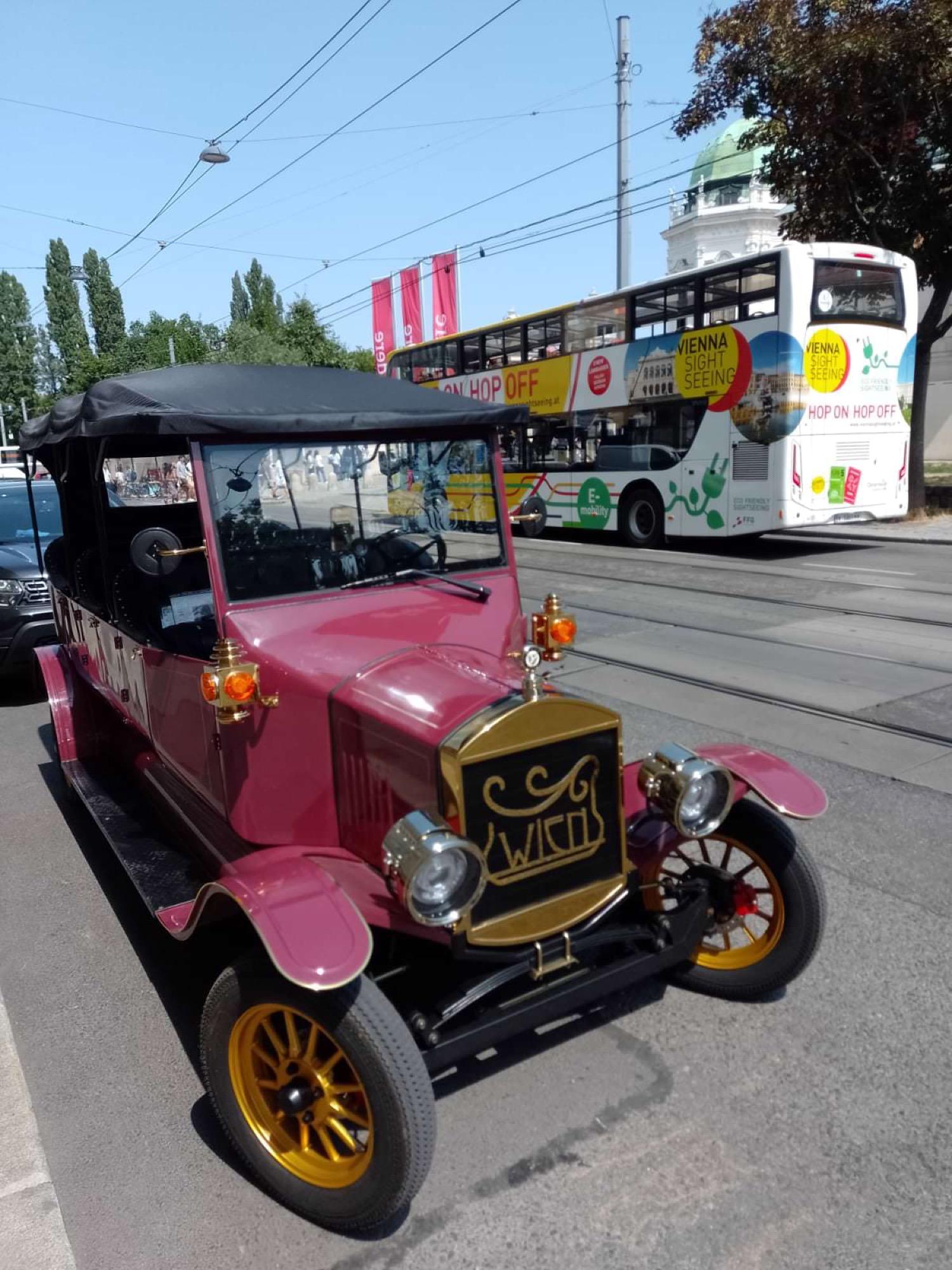 Burgundy vintage electric tour vehicle in the Vienna Grand Tours fleet